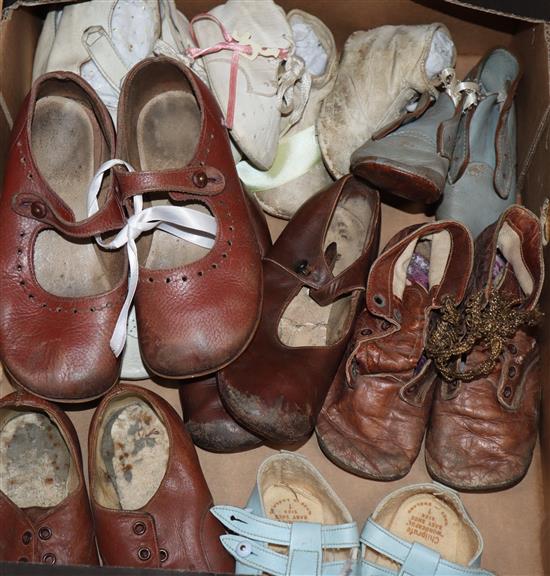 A collection of dolls / childrens shoes